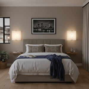 Bedroom with two opaque glass wall lights above bedside tables, enhancing a serene atmosphere.
