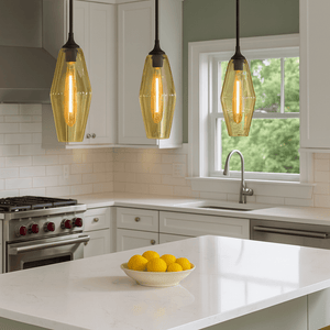 Modern kitchen with pendant lights hanging above a countertop.