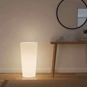 Stylish RGBW planter floor lamp emitting a soft glow beside a wooden console table and mirror.