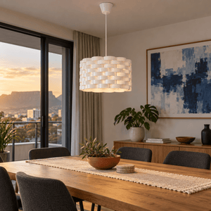 Inter Acrylic Pendant Light — above an oak dining table in daylight
