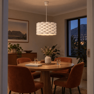 Inter Acrylic Pendant Light — over a round dining table at dusk