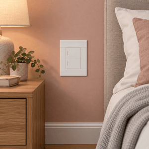 Veti 2 White Two Lever Wall Switch in a realistic clay-pink bedroom setting
