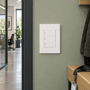 Veti 2 White Three Lever Wall Switch in a realistic sage office corridor setting