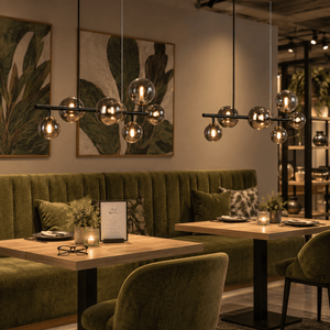 Linear Bubble Pendant Light — Retail showroom dining display with pendant ON (evening hospitality vibe)
