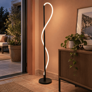 Pana Woven Flex LED Floor Lamp lifestyle: Close detail of woven tube and base on modern patio doorway interior