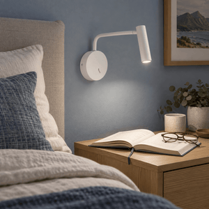 Minine Sand White LED Wall Light lifestyle: Bedside reading corner with sand-white wall light