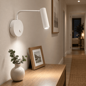 Minine Sand White LED Wall Light lifestyle: Close detail of sand-white wall light articulation on a hallway wall