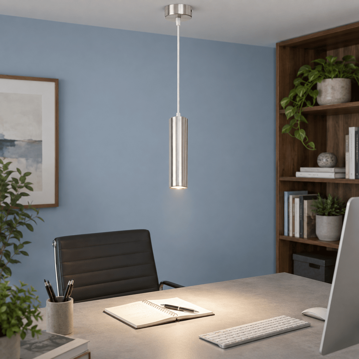 Pinkie Satin Chrome Flute Pendant Light lifestyle image: Office workstation with subtle powder-blue wall and controlled task light