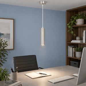 Pinkie Satin Chrome Flute Pendant Light lifestyle image: Office workstation with subtle powder-blue wall and controlled task light