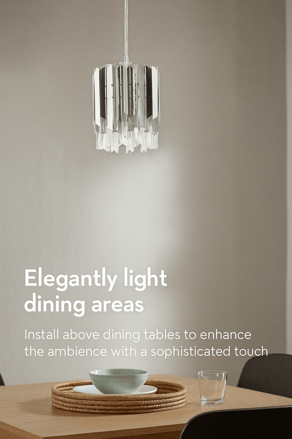 Modern pendant light fixture hanging above a dining table with a neutral background.