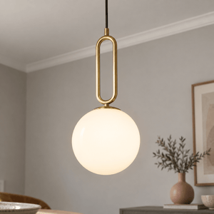 Croquet Large Pendant Light lifestyle image: Close detail of the pendant, showing diffusion and antique brass