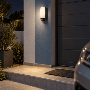 Outdoor Wall Mount Motion Sensor Bulkhead lifestyle image: Garage entrance bulkhead by a tiled stoep