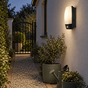 Outdoor Wall Mount Motion Sensor Bulkhead lifestyle image: Pathway wall bulkhead near a garden gate
