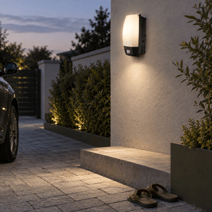 Outdoor Wall Mount Motion Sensor Bulkhead lifestyle image: Exterior driveway boundary wall bulkhead over a low step