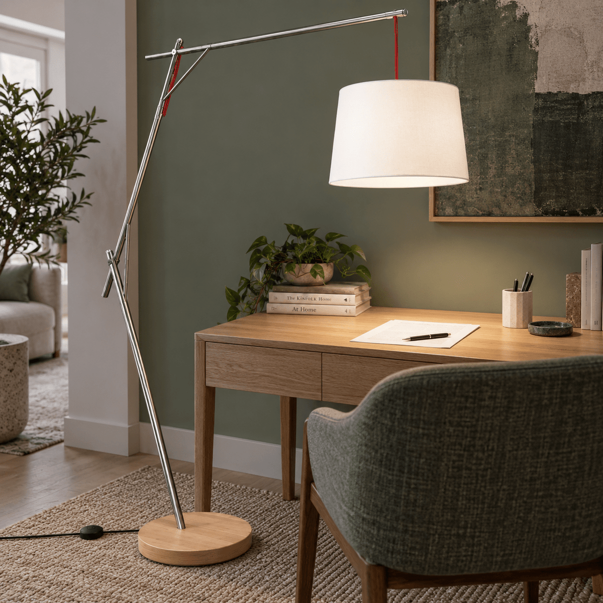 Cantilever Floor Lamp with Foot Switch & White Shade lifestyle image: Overhead task at a small lounge desk (lamp ON)