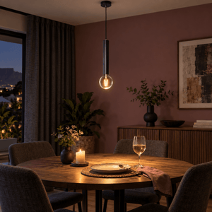 Black Flute Pendant Light Thomas — PROMPT 4 — Evening dining with pendant highlighted in a muted lounge