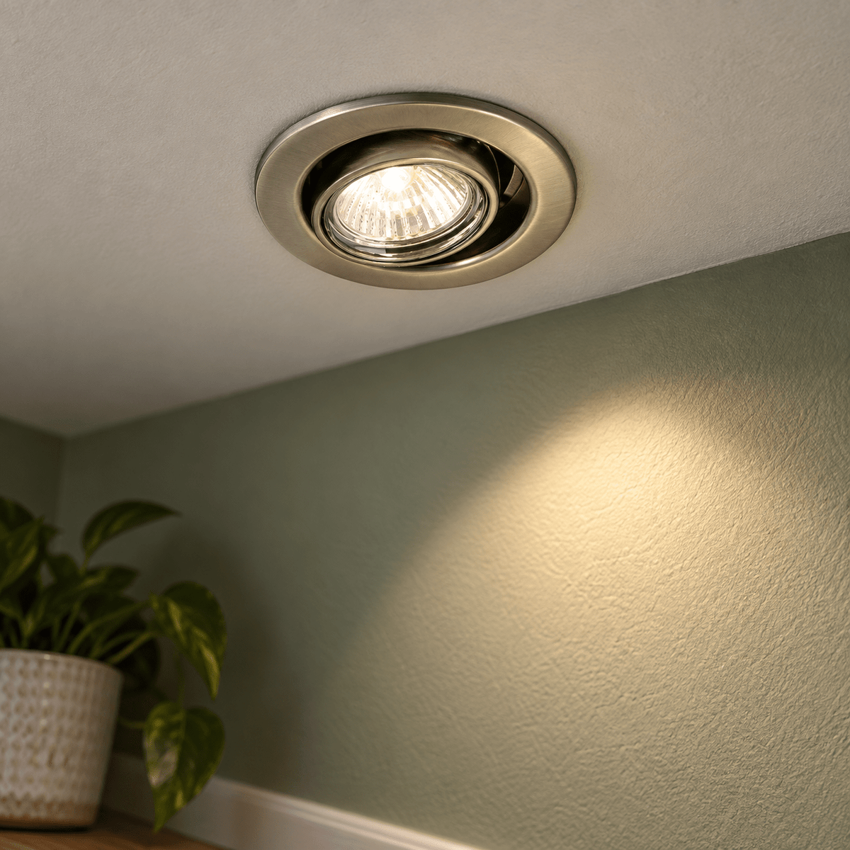 Gun Metal Downlight Liam — PROMPT 3 — Close-Up Readability of Tilted Recessed Trim