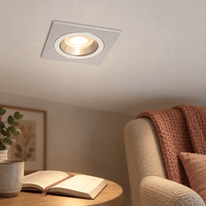 Silver Square Downlighter — PROMPT 3 — Close-up reading of the recessed square trim
