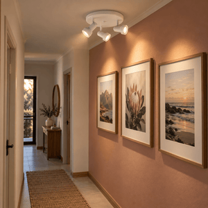 Matthew Indoor 3 Light Spotlight - Matt White — PROMPT 1 — Gallery hallway with muted clay wall