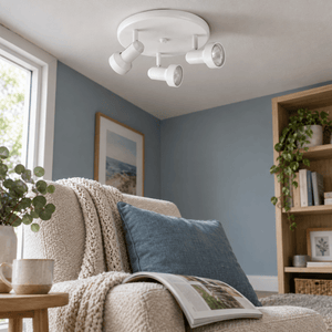 Matthew Indoor 3 Light Spotlight - Matt White — PROMPT 4 — Quiet living room corner, spotlight OFF with visible aimed heads