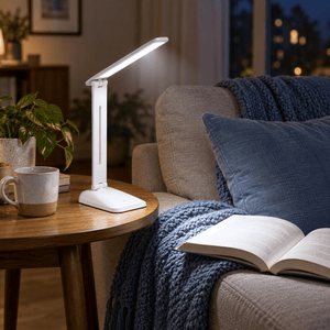 Sophia Rechargeable LED Table Lamp lifestyle scene: Living room side table, aiming light toward a couch reading chair