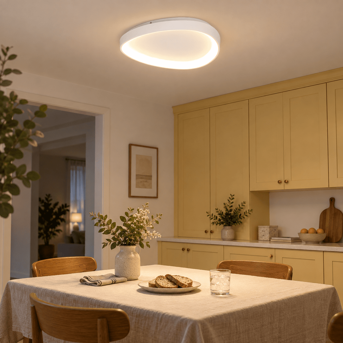 Ovoid Framed Indoor Ceiling Light - Isabel lifestyle scene: Dining room flush light over a small table