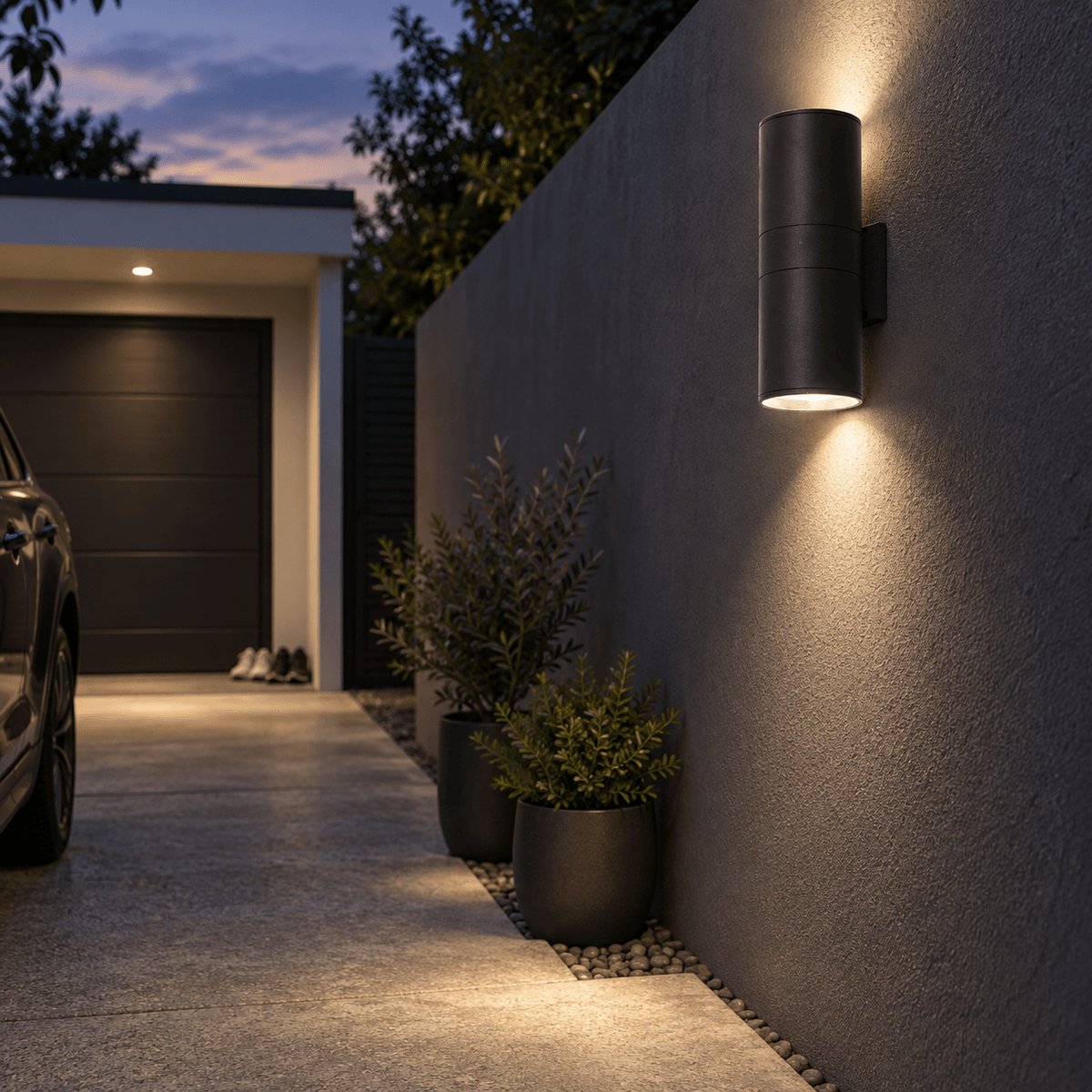 Outdoor Wall Light Ayelen - Up & Down lifestyle scene: Garage drive edge along boundary wall