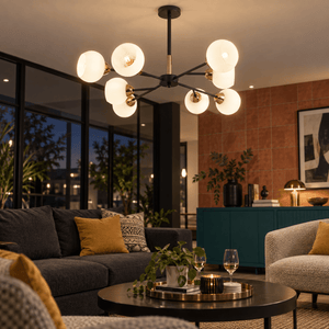 Dalia Black & Gold Chandelier - 8 Light - White Glass lifestyle scene: Open-plan reception lounge with warm seating