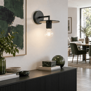 Trends Black Indoor Wall Light — Open-plan living area, daylight + lamp ON over a sideboard (straight-on detail with scale cue)
