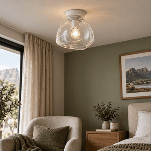 Small Glass Molten Ceiling Light – Clear Glass and White — above a bedroom reading nook