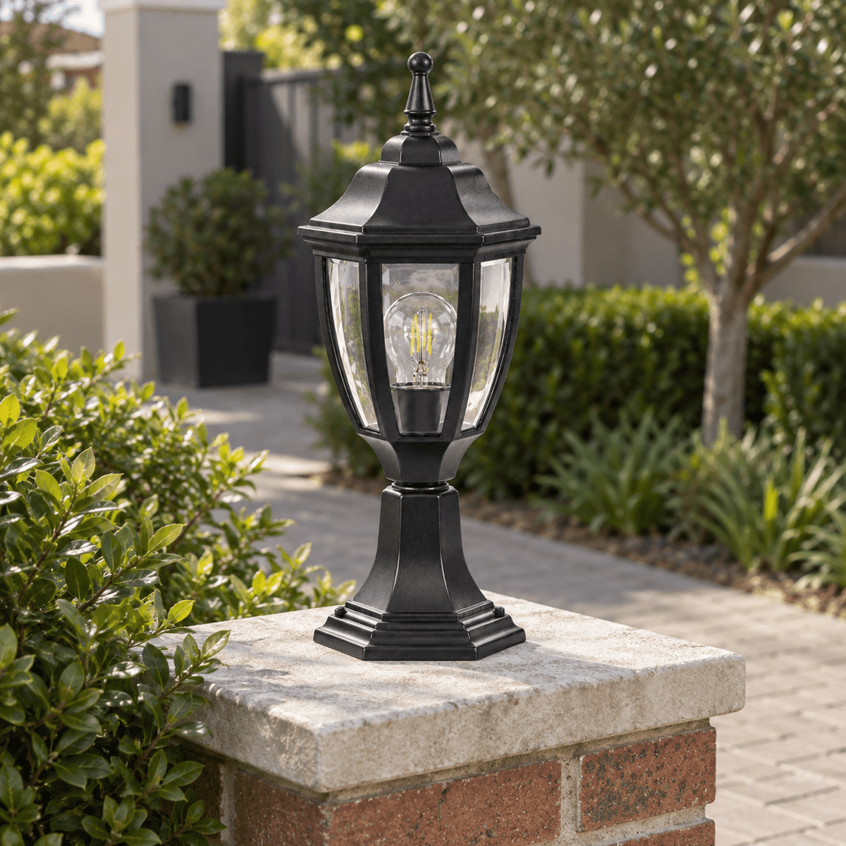Black Outdoor Pillar Light - Die Cast Aluminium IP33 — on a brick garden pillar in daylight