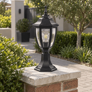 Black Outdoor Pillar Light - Die Cast Aluminium IP33 — on a brick garden pillar in daylight
