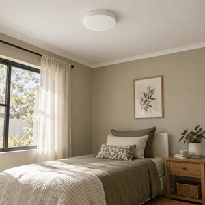 Small Polycarbonate LED Indoor Light — mounted above a guest bedroom