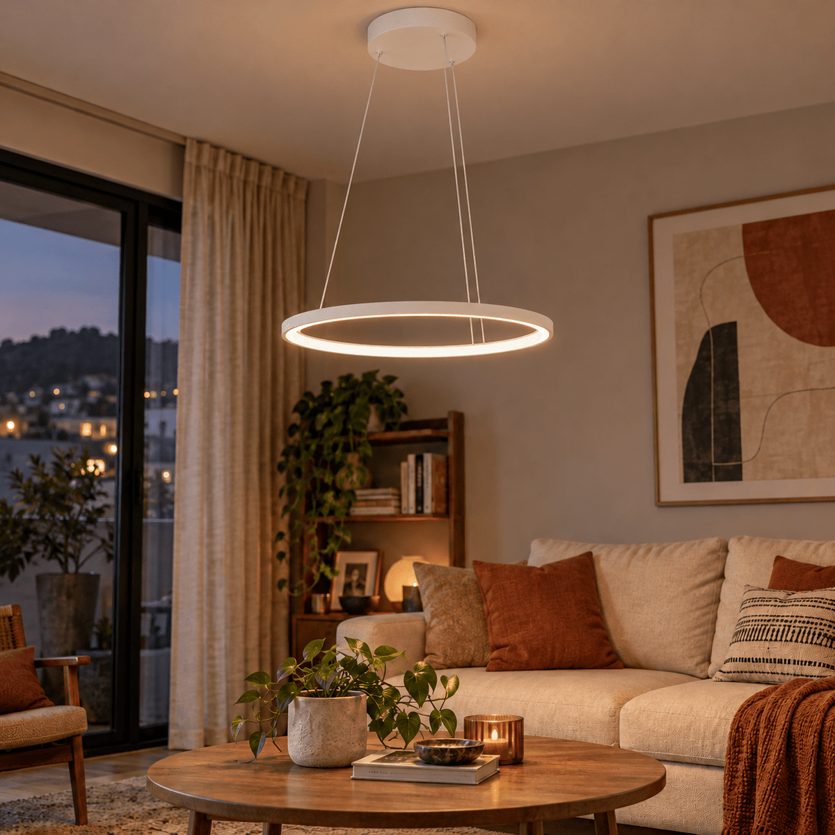 White 60cm continuous LED ring pendant illuminated in a lounge at dusk.