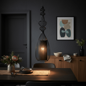 Tokyo 3 Black Wire Frame Pendant light hanging over a dining table with a floral centerpiece.