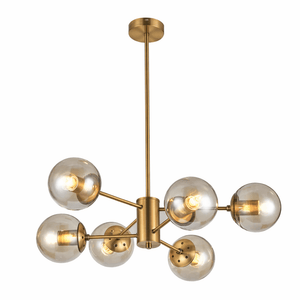 Gold chandelier with multiple glass shades on a white background