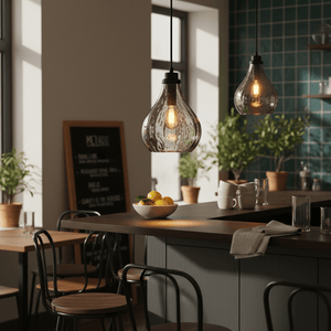 Stylish pendant light hanging over a kitchen island with a bowl of lemons, showcasing a modern interior.