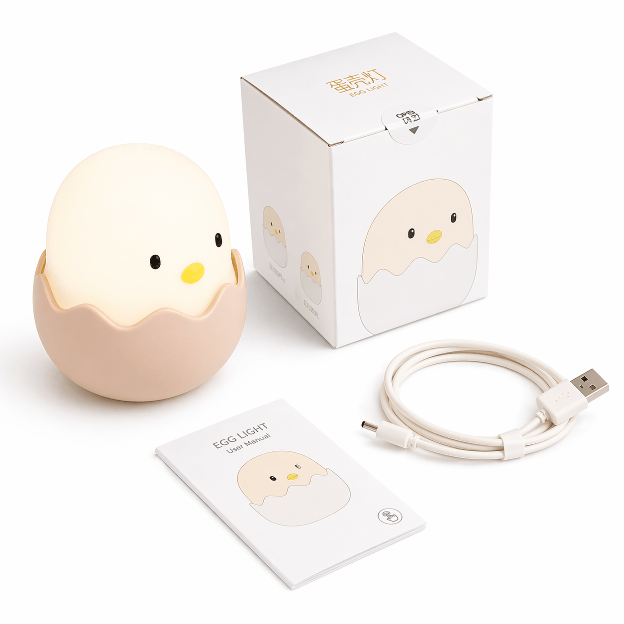Egg-shaped night light with packaging, USB cable, and user manual on a white background