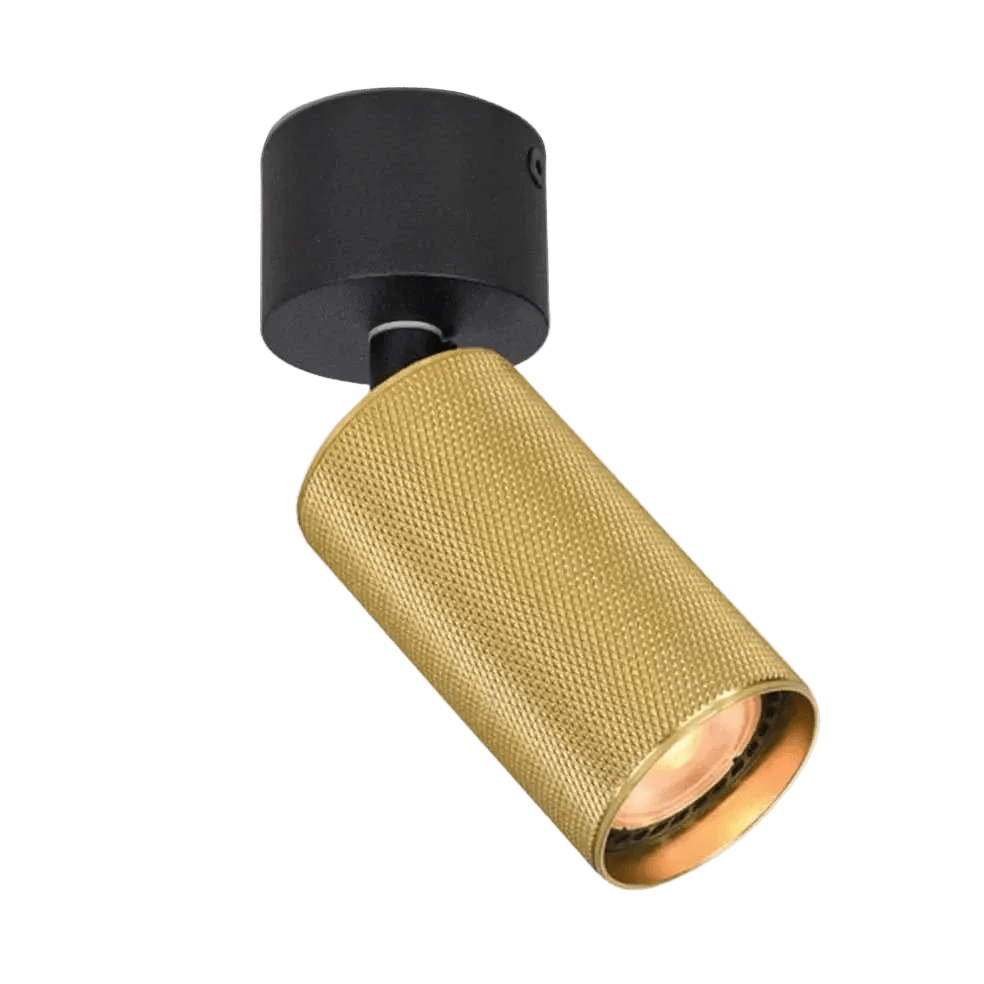 Black circular ceiling mount with annealed gold textured cylindrical shade, angled spotlight against black background.