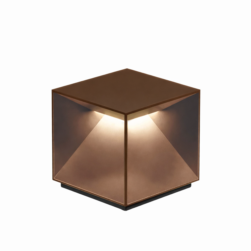 Copper cube-shaped lamp on a white background