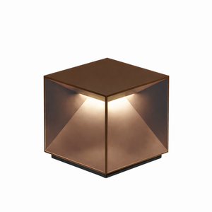 Copper cube-shaped lamp on a white background