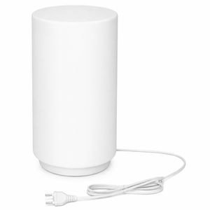 White cylindrical lamp with a power cord on a white background