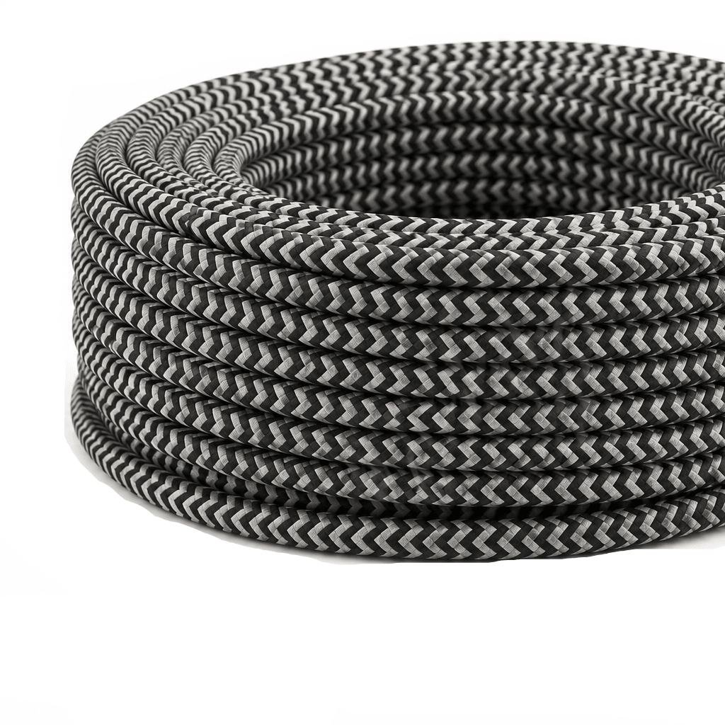 Coiled black and white canvas cable with a zigzag pattern, placed on a white background.