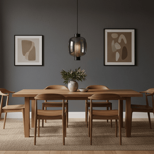 Chicago Large Black Glass Pendant light hanging above a wooden dining table with chairs, framed art on the wall.