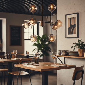 Stylish black and bronze chandelier with glass shades hanging over a dining table in a modern restaurant setting.