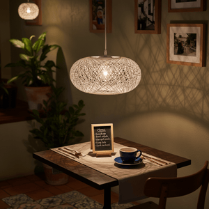 A 400mm white twine pendant light hangs above a dining table set with a blue cup and a menu board.