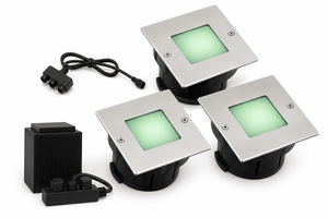 Three square outdoor lights with green LED illumination on a white background
