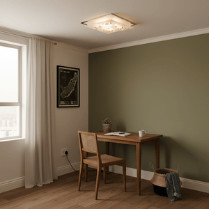 Polished chrome square ceiling light illuminating a cozy workspace with wooden desk and chair.