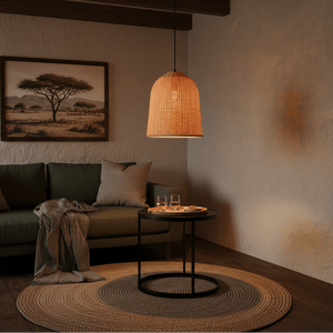 360mm rattan pendant light hanging above a cozy lounge area with a green sofa and a round rug.