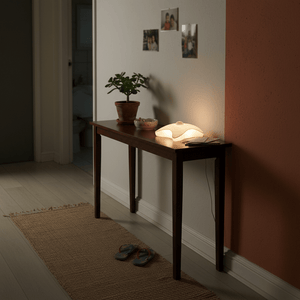 Battery-operated night light on a wooden table, providing a soft glow in a cozy indoor setting.